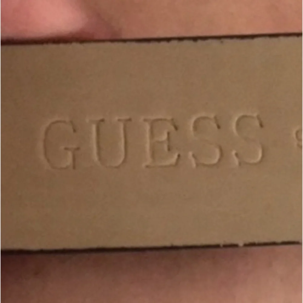 Guess Genuine Leather animal print size 1.5” silver hardware G w/rhinestones